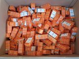 a box full of orange boxes with labels on them