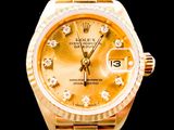 an image of a gold rolex watch with diamonds on the dial