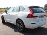 the rear end of a white volvo suv parked in a parking lot