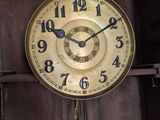 a clock that is hanging on the wall in the room