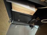 an image of a metal cabinet with a bunch of papers on it