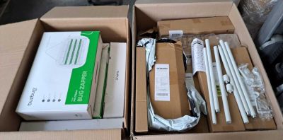two boxes of electronic equipment sitting on a table