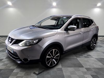 the silver nissan suv is parked on a checkered tile floor