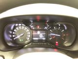 a close up of a car dashboard with a speedometer and gauges