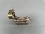 a small metal object that is sitting on a table