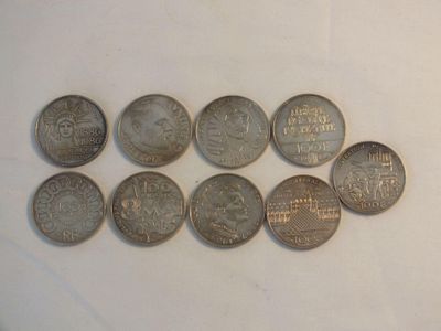 a lot of coins sitting on a white surface
