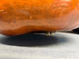 a close up picture of a pumpkin on a table