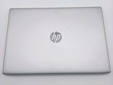 a laptop that is sitting on a white table