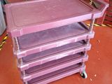 a purple cart that is sitting on a red floor