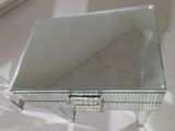 a glass table with a mirror on top of it