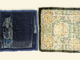 two pieces of fabric with flowers on them on a table