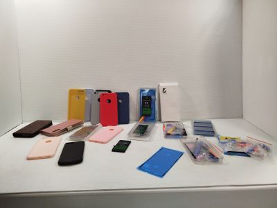 several cell phones are sitting on a white table in front of a mirror