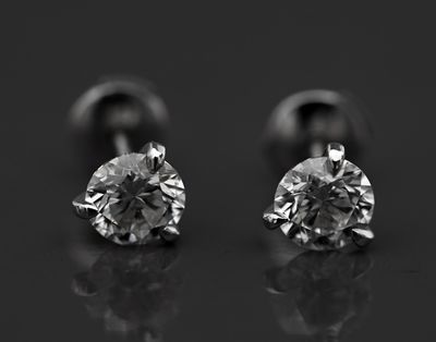 black and white photograph of a pair of diamond earrings