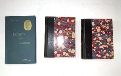 two books are sitting on a table next to each other