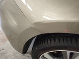 a close up of a car ' s tire on the ground