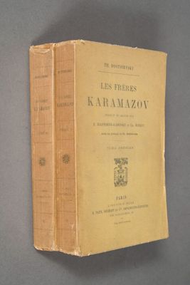 two books sitting on top of each other on top of a table