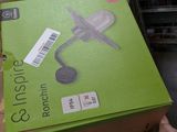 someone is holding a box with a pair of scissors in it