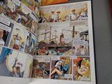 a picture of a comic book open on a table