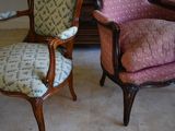 two chairs sitting next to each other in a room