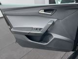 the door of a car with the driver ' s side door open