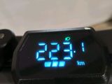 a digital clock displayed on the handlebar of a bike