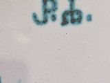 a close up of a plate with writing on it
