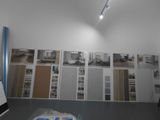 a picture of a room with a lot of pictures on the wall