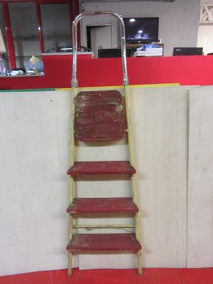 a ladder that is leaning against a wall in a room