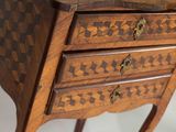 a small wooden table with a drawer on top of it