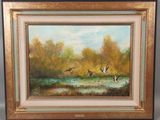 une peinture à l'huile représentant des canards survolant un étang dans une zone boisée
