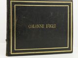 a close up of a black book with gold lettering on it