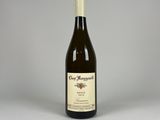 an image of a bottle of wine sitting on top of a table