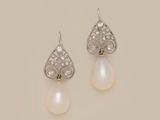 a pair of pearl and diamond earrings
