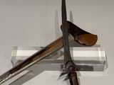 a knife and a knife holder on a white surface