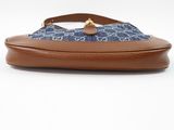 a close up of a purse with a blue and white pattern on it