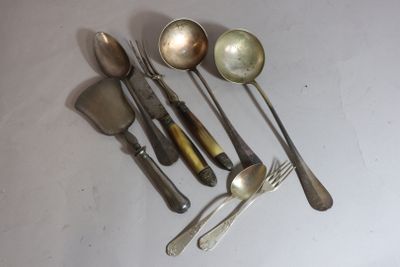 several spoons, forks and spoons are arranged on a white surface