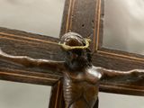 a statue of jesus on a cross with a crown of thorns on his head