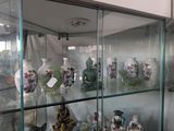 many vases on display in a glass case