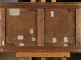 an old wooden easel with a painting on top of it