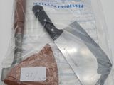 a plastic bag with a knife and a piece of meat in it