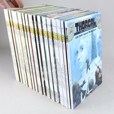 a person holding a stack of books in front of a white background