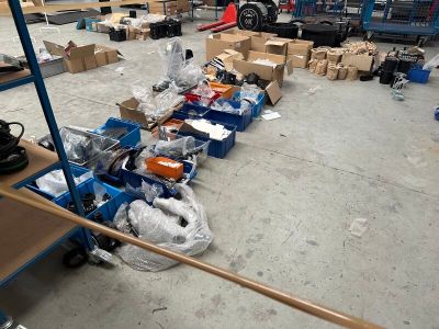 a lot of boxes and boxes on the floor in a warehouse