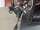 a laptop that has a bunch of wires on it