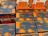 several boxes of wokin wokin beer sitting on top of a table