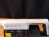 a vacuum that is sitting on a table next to a knife