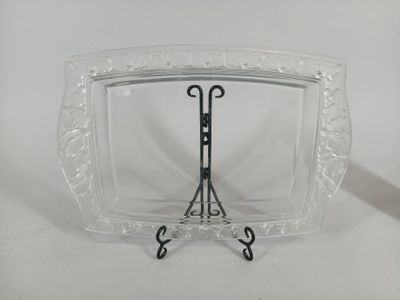 a glass display case with a pair of scissors in it