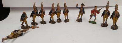 many figurines of soldiers on display on a table