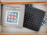 a box with a picture of a bunch of beads in it