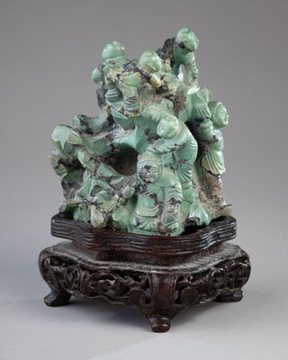 chinese carved jade figurine of a group of people on a stand