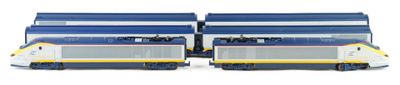 two blue and white trains on the tracks next to each other